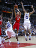 Davidson's Stephen Curry passes under pressure by UCLA